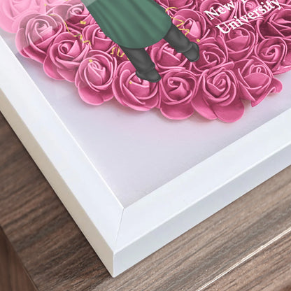 Heart-shaped graduation gift flower shadow box with pink roses and white frame, perfect graduation gift.